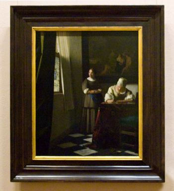 Johannes Vermeer's Lady Writing a Letter with her Maid with frame