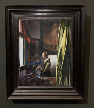 Johannes Vermeer's Girl Reading a Letter at an Open Window with its frame