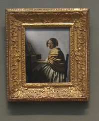 A Young Woman Seated at the Virginals