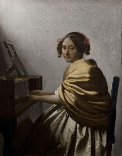 A Young Woman Seated at the Virginals