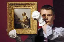 A Young Woman Seated At The Virginals, attributed to Johannes Vermeer