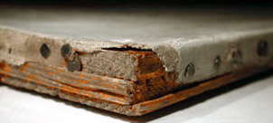Detail of tacking edge showing canvas loss at the stretcher corner.