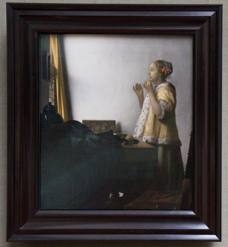 Womah with a Pearl Necklace by Johannes Vermeer