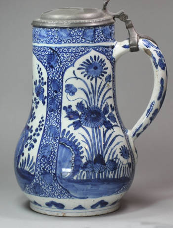 Delft Blue and White Tankard, Late 17th century with pewter cover, decorated in the transitional style with panels of flowers against a scrolling background, with the mark of Adriaen Pynacker 